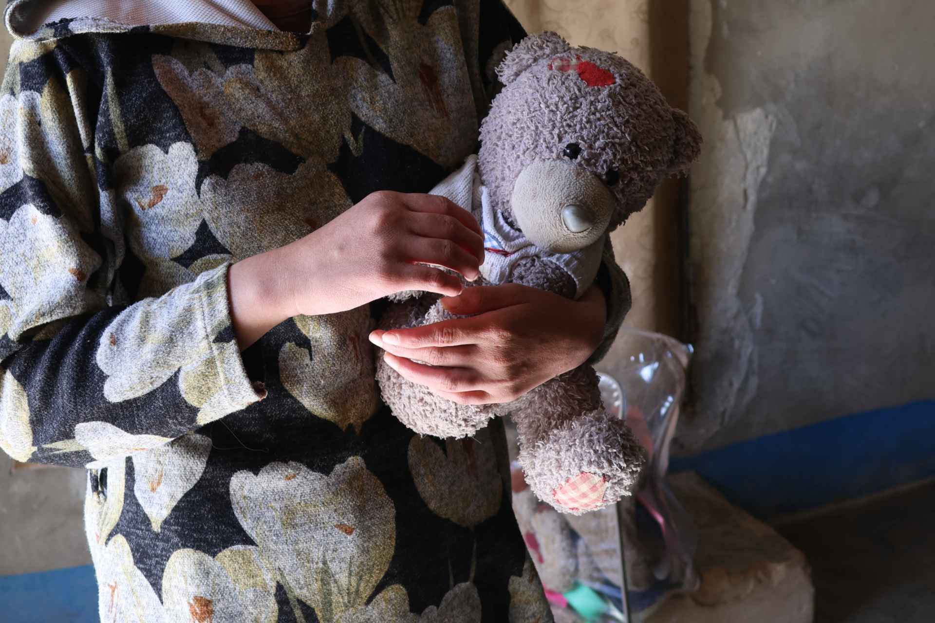 Hala shows her favorite toy.
