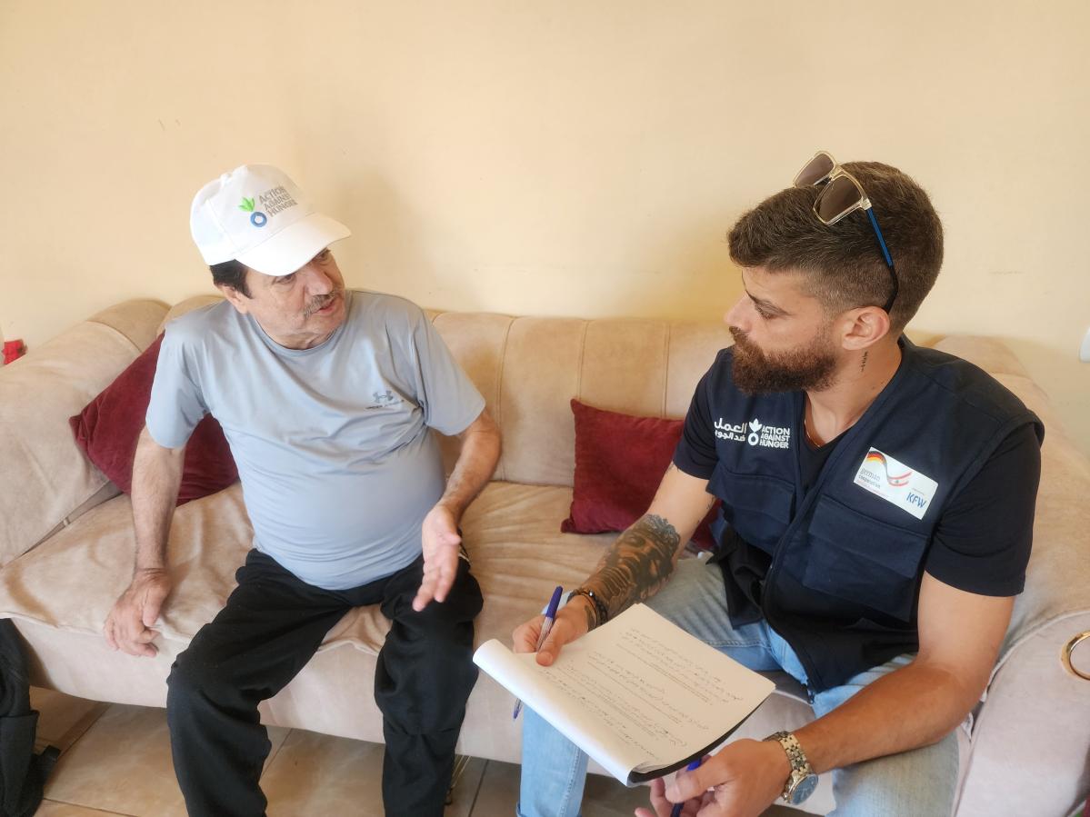 Action Against Hunger giving a brief to Walid about the activity