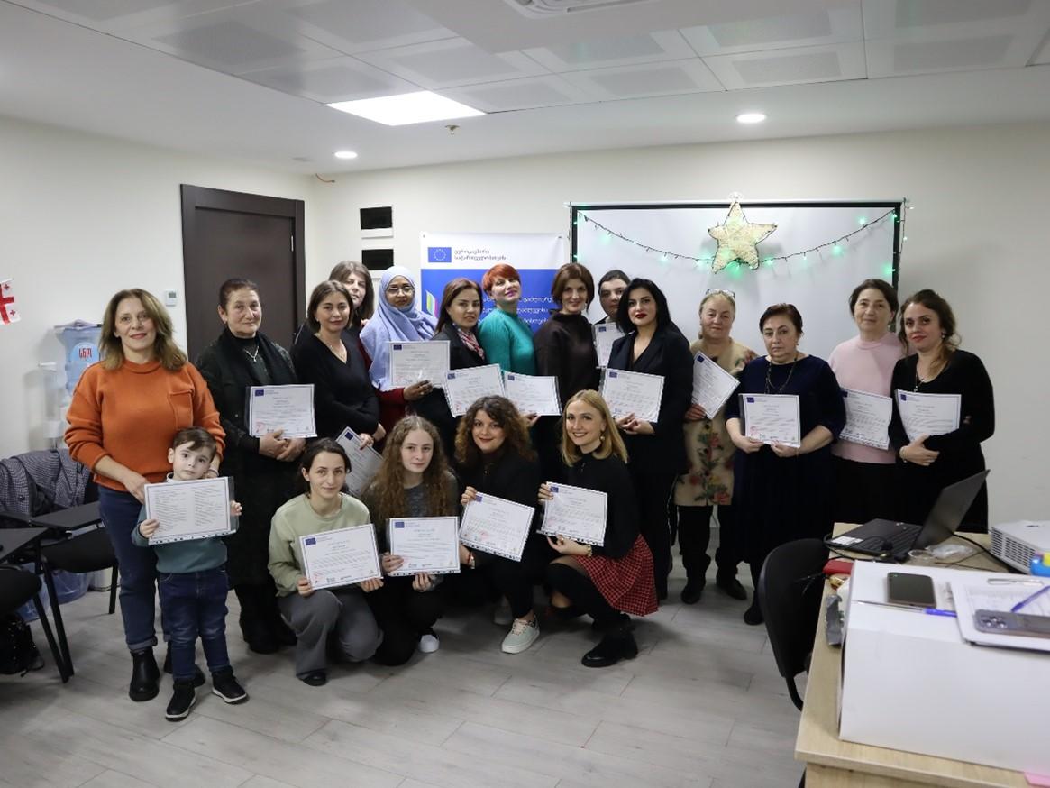 Batumi Shuttle participants holding their Shuttle participation certificates