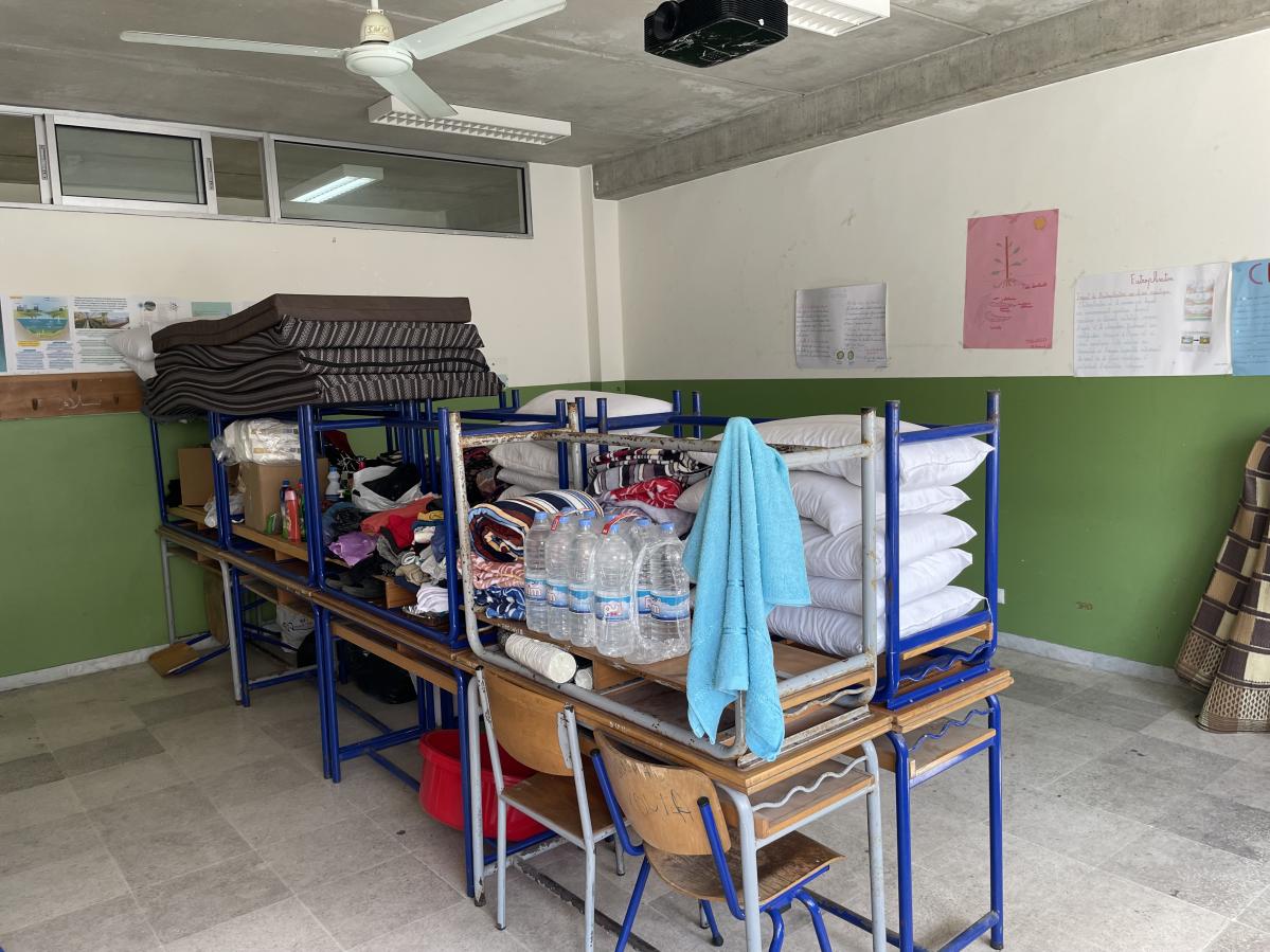 The room of Hayat and her daughter in the collective shelter divided into two (being used for two families).