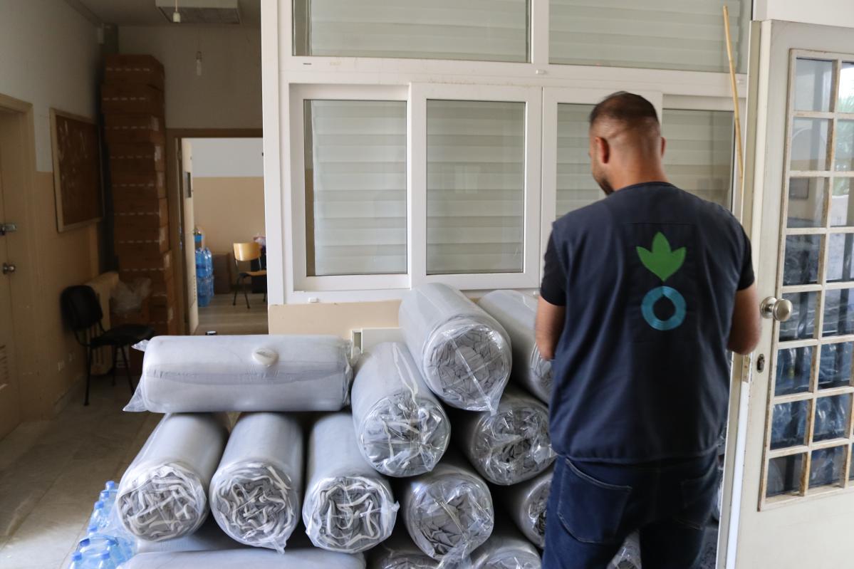 During the distribution of core relief items in the collective shelter where Zeinab is staying