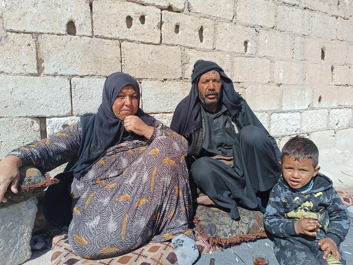 Wadha, 40, and her husband Abu Ahmad, 52, with their child