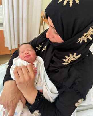 Youssra and her newborn 